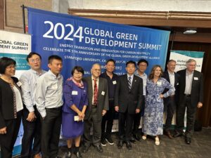 Group photo with Dr. Richard Dasher in front of conference banner